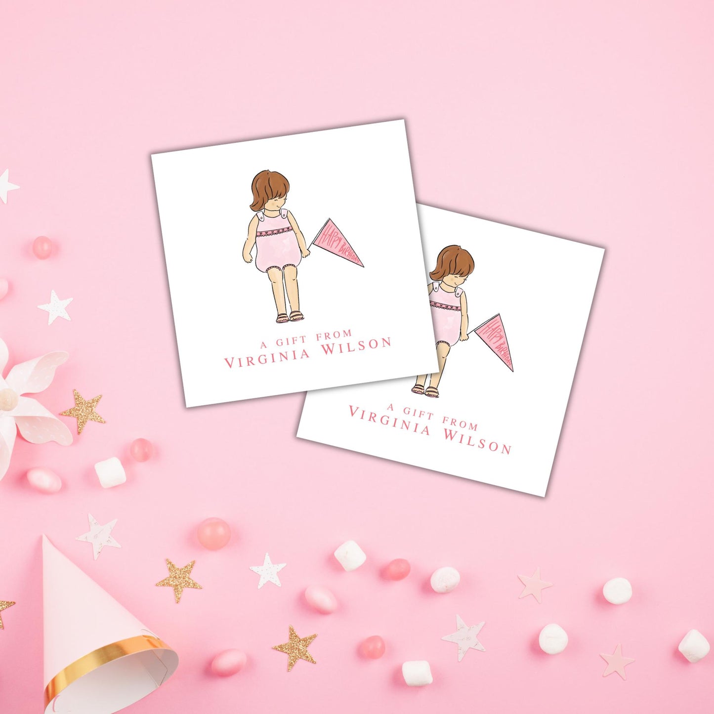 two white cards with illustrations of a girl and a pink flag, along with the text "A gift from VIRGINIA WILSON". The cards are placed on a pink background with scattered confetti and stars.