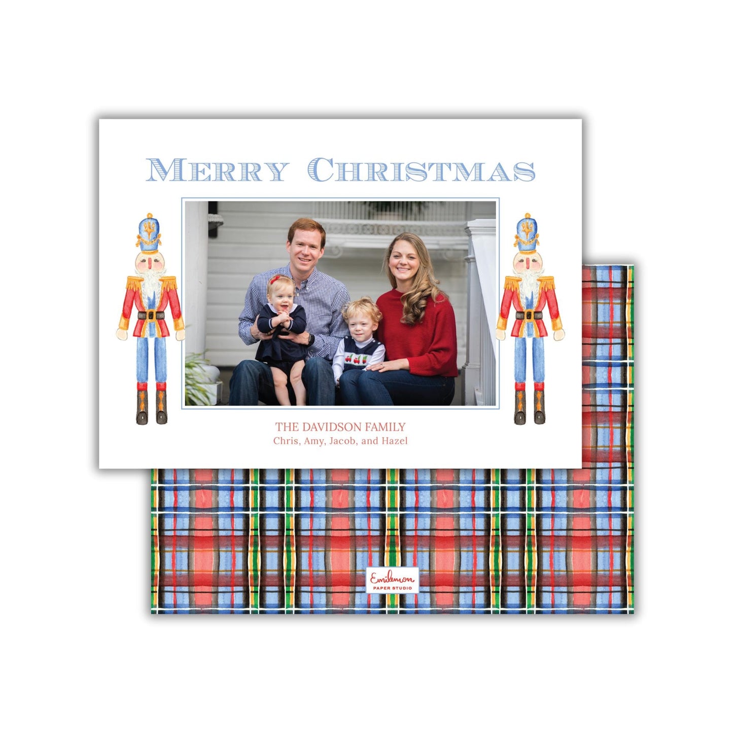 A family portrait of a man, woman, and child, with nutcracker figures on either side of the photo. The text "Merry Christmas" is displayed above the photo, and "THE DAVIDSON FAMILY Chris, Amy, Jacob, and Hazel" is written below the image.
