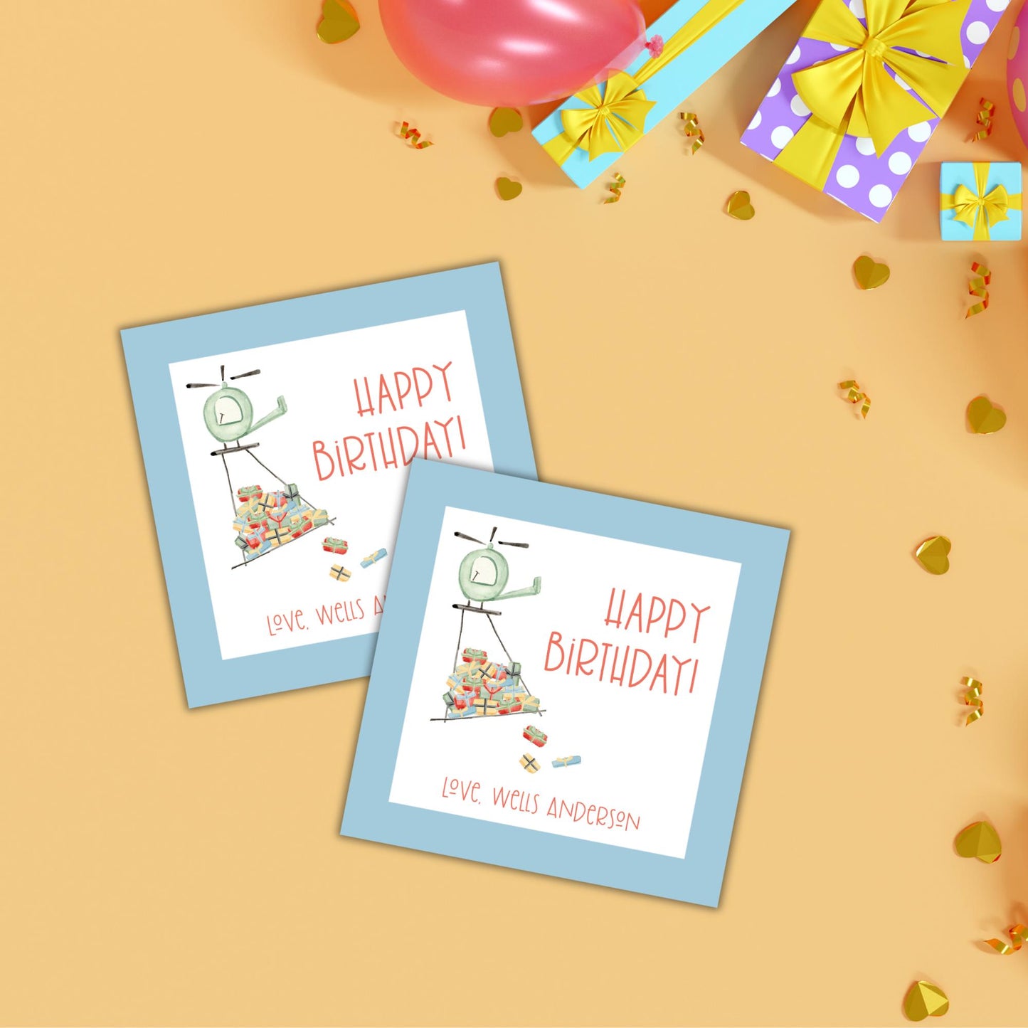two happy birthday cards on a table with balloons and streamers