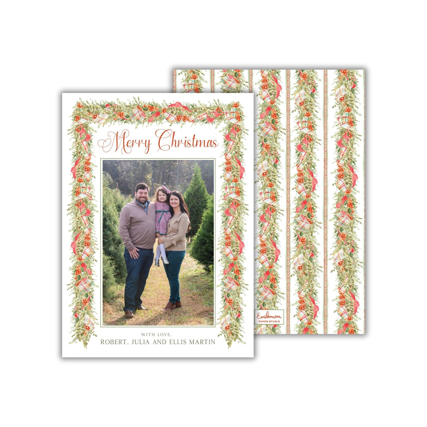 A family portrait of a man, woman, and child standing together in a natural setting, surrounded by a decorative wreath.