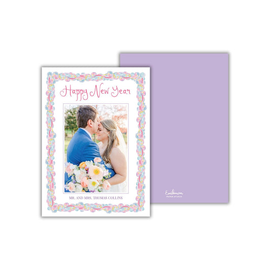 A wedding card featuring a couple embracing and smiling, with a colorful border and text that reads &quot;Happy New Year&quot;.