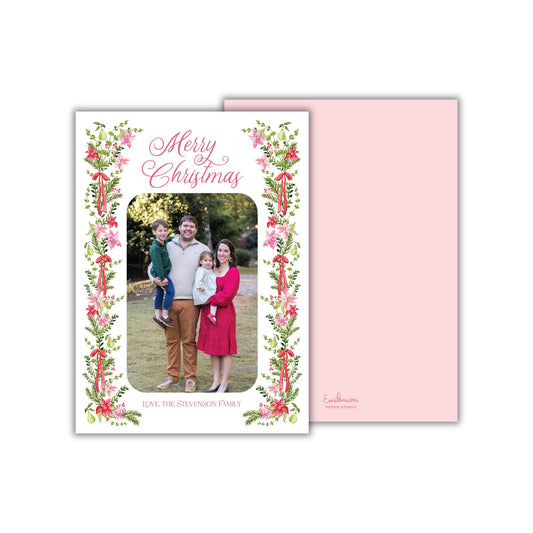 A family portrait of a man, woman, and child, surrounded by a floral border and the text &quot;Merry Christmas&quot; on a white background.