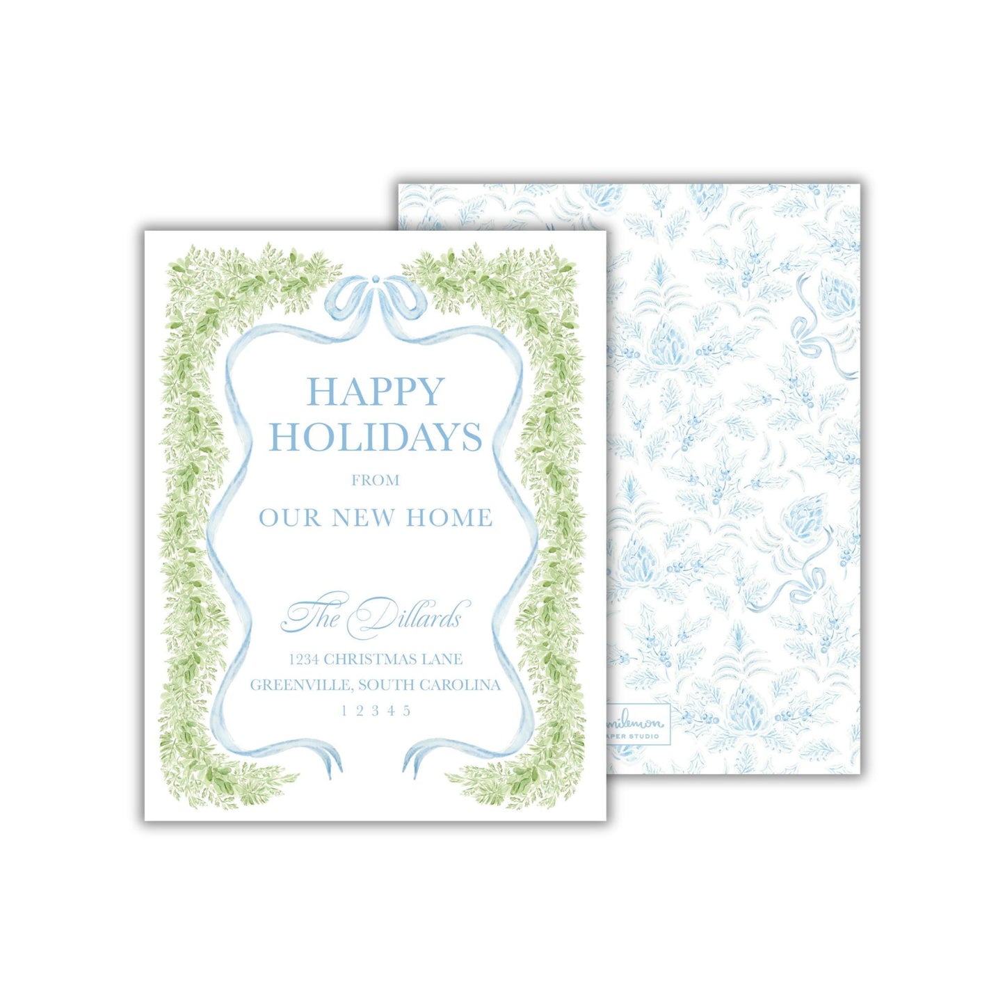 The image is a holiday card with a festive design featuring green and blue elements, including a ribbon border and a pattern of green leaves. The card is addressed to &quot;The Dallards&quot; and is from their new home, located at 1234 Christmas Lane in Greensville, South Carolina.