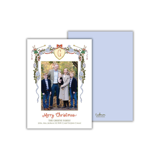 A family portrait of a group of people, likely a family, with a decorative border around the photo. The text on the card reads &quot;Merry Christmas&quot; and &quot;The Grene Family&quot;, indicating the holiday season and the name of the family.