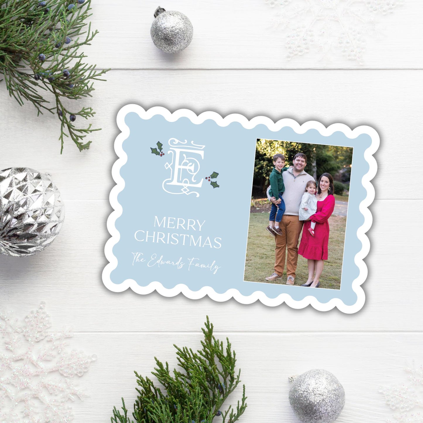 A family photo is displayed on a Christmas card with the text &quot;Merry Christmas The Edwards Family&quot; and a decorative border.