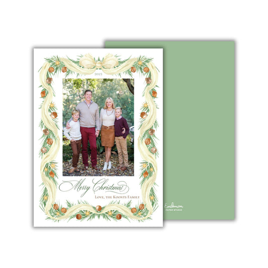 A family portrait of a man, woman, and two children, surrounded by a decorative border with a festive design.