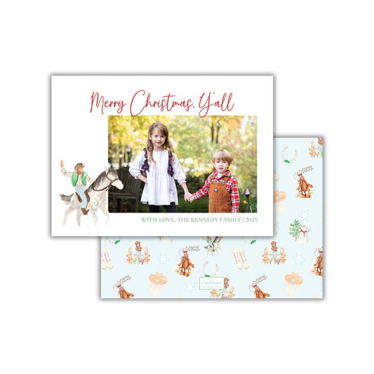 A Christmas card featuring two children, a horse, and a cowboy, with the text &quot;Merry Christmas Y&#39;all&quot; and &quot;With Love, The Kennedy Family&quot; printed on it.