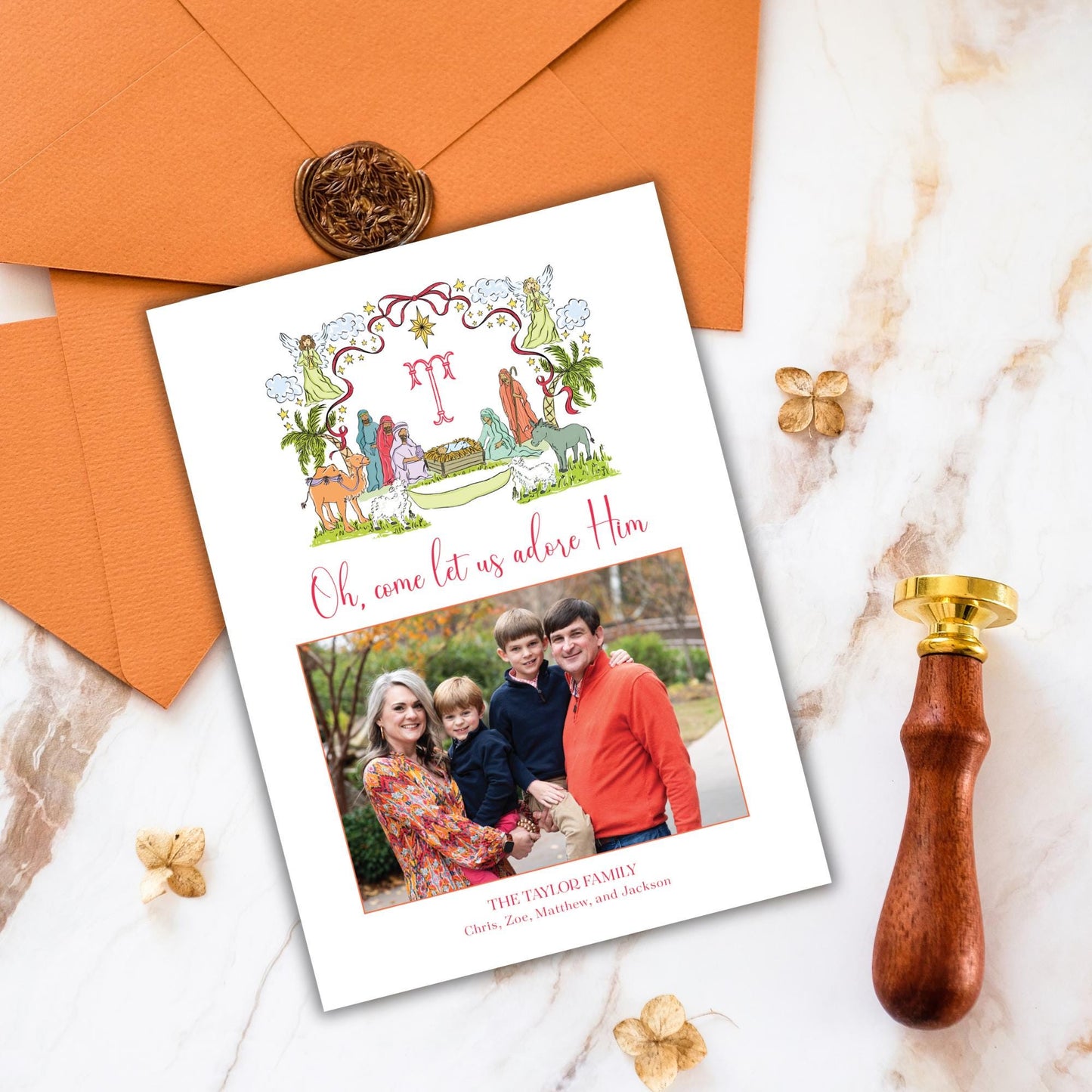 a family portrait of a woman, a man, and two children, along with a greeting card and some decorative elements.