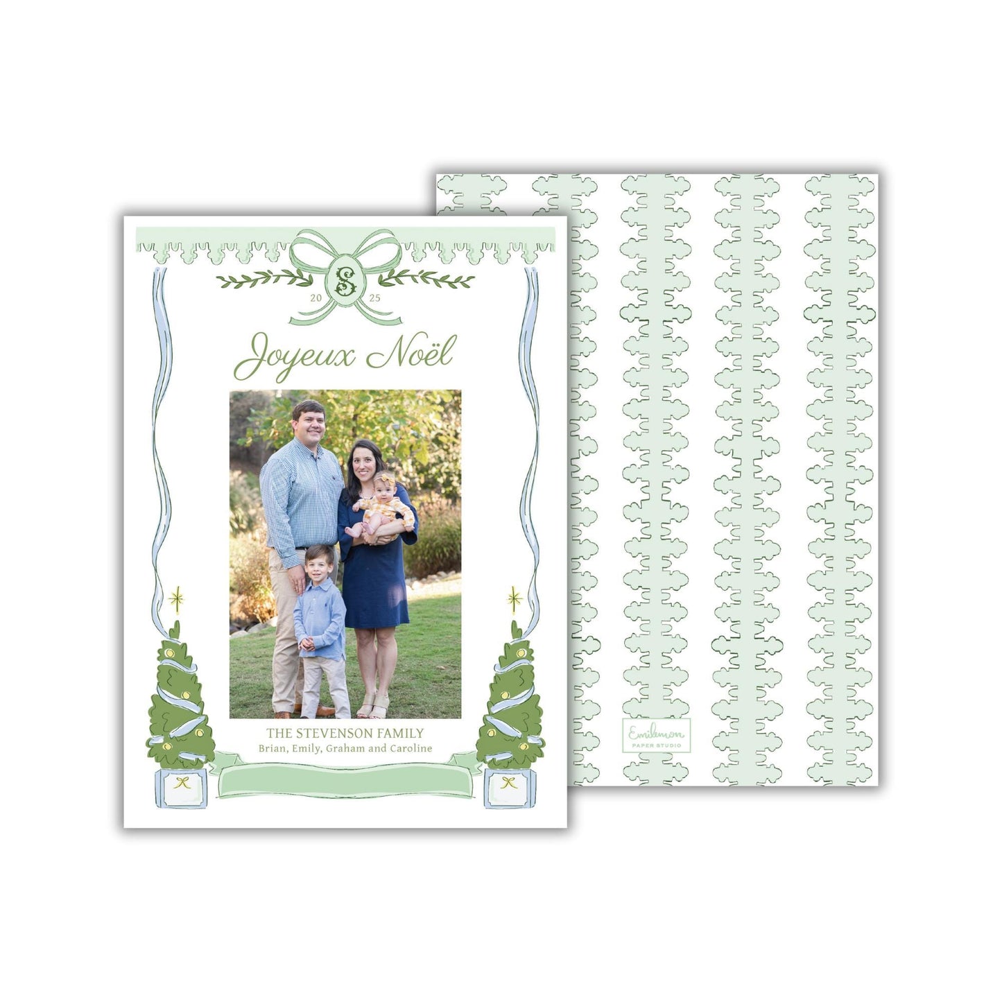 A family portrait of a man, woman, and child, with the text &quot;Joyeux Noel&quot; and &quot;The Stewart Family&quot; written above the photo.