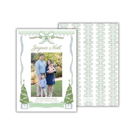 A family portrait of a man, woman, and child, with the text &quot;Joyeux Noel&quot; and &quot;The Stewart Family&quot; written above the photo.