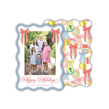 A family portrait of a group of people, including adults and children, posing together in a garden setting. The text "Happy Holidays" is displayed at the bottom of the image, along with the phrase "With Love, the O'Connells (2025)" written in cursive.