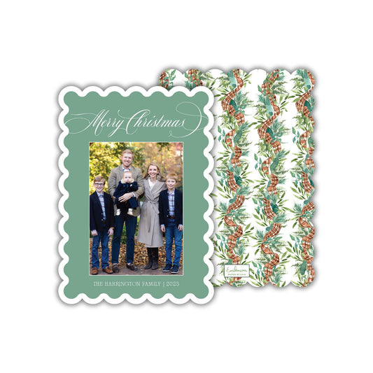 A family portrait of a group of people, including adults and children, is displayed on a green card with a scalloped edge.