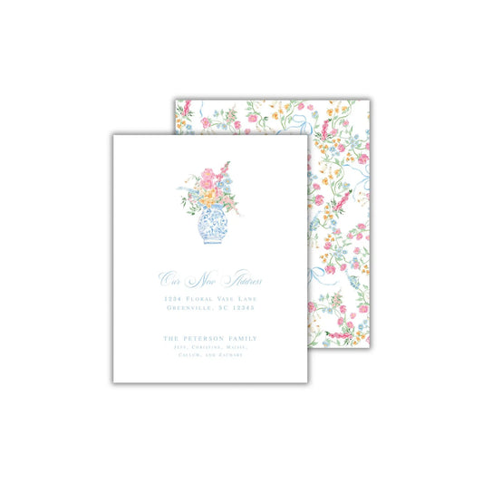 a wedding card with a vase of flowers on it