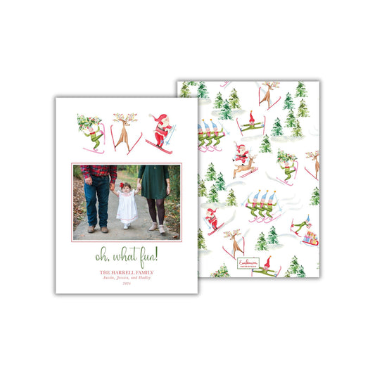 The image is a holiday-themed card featuring a family photo and various winter-themed illustrations, including people skiing, snowmen, and reindeer.