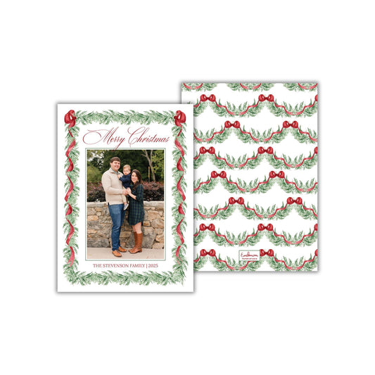 A Christmas card featuring a family photo of a man, woman, and child, surrounded by a festive wreath design.