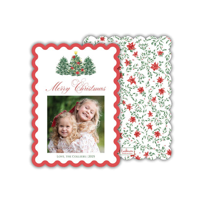 A Christmas card with a photo of two young girls and a wavy border. The card has a floral pattern and the text "Merry Christmas" and "Love, the Colliers | 2005" printed on it.