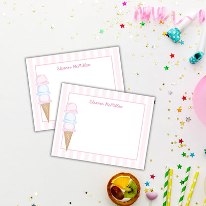 two ice cream cones on top of a table