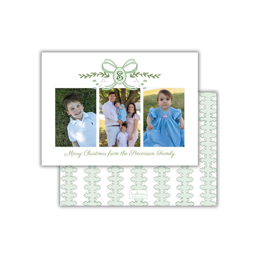 A family photo collage with a green ribbon design and the text &quot;Merry Christmas from the Stevensons Family&quot; displayed on the front.