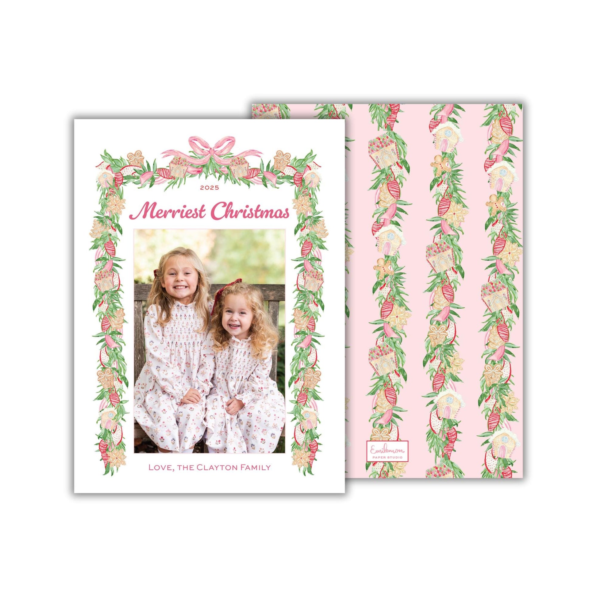 A 2015 holiday card featuring two young girls in a festive floral frame, with a pink and green color scheme.