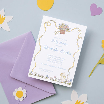 a baby shower is shown next to a purple envelope