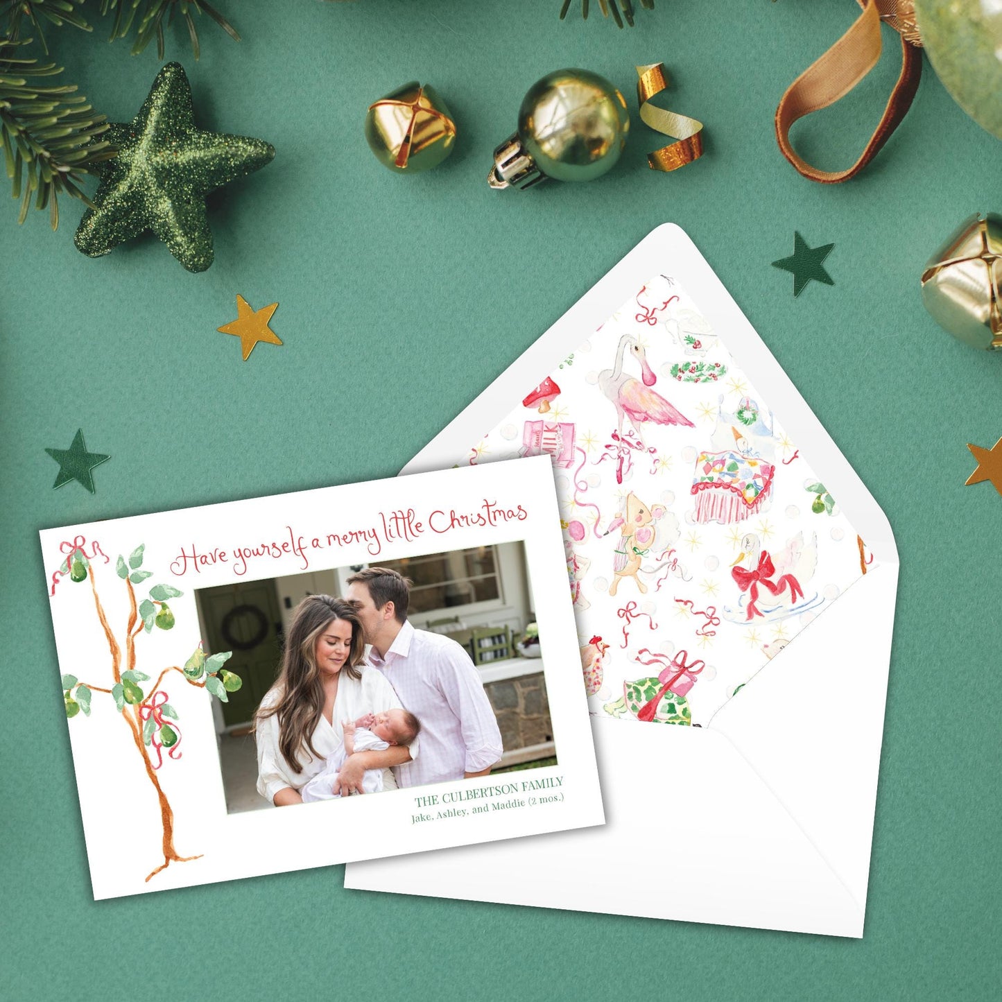 A Christmas card with a photo of a family, surrounded by ornaments and a star on a green background.