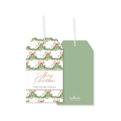 two tags, one with a Christmas-themed design and the other with a plain green background.