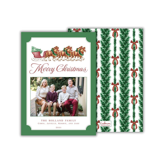 A green Christmas card with a family photo and the text &quot;Merry Christmas&quot; and &quot;The Holland Family&quot; printed on it.