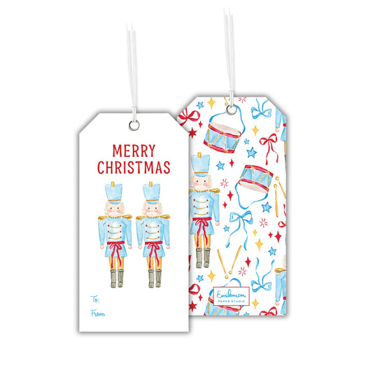 two white tags with Christmas-themed illustrations and text.
