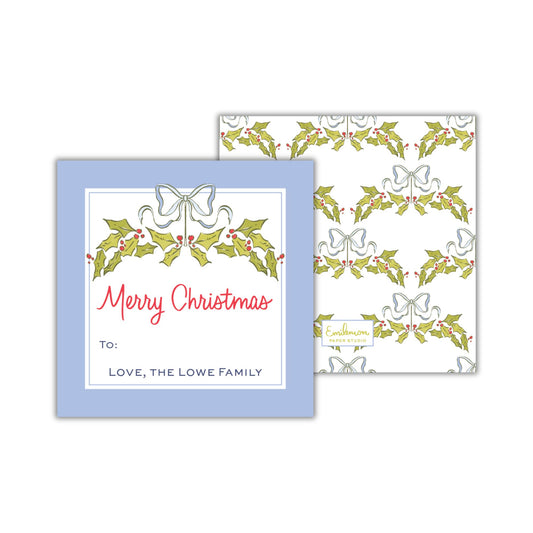 a blue greeting card with a holiday-themed design, featuring a pattern of holly leaves and bows. The card is addressed to &quot;Love, The Lowe Family&quot; and is part of a larger collection of holiday-themed designs.
