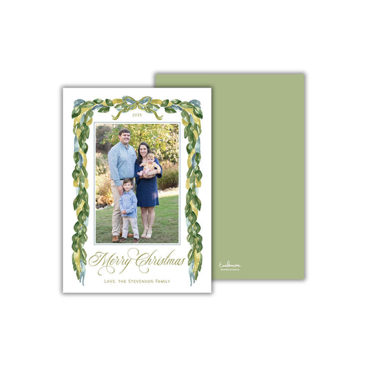 A family portrait of a man, woman, and child, with a green border and a message that reads &quot;Merry Christmas Love, The Stevenson Family&quot;.