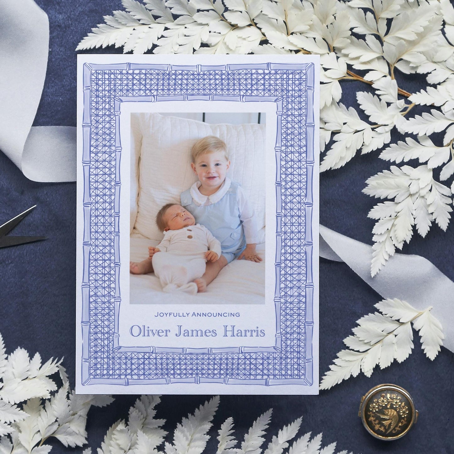 a card with a picture of a baby and a button