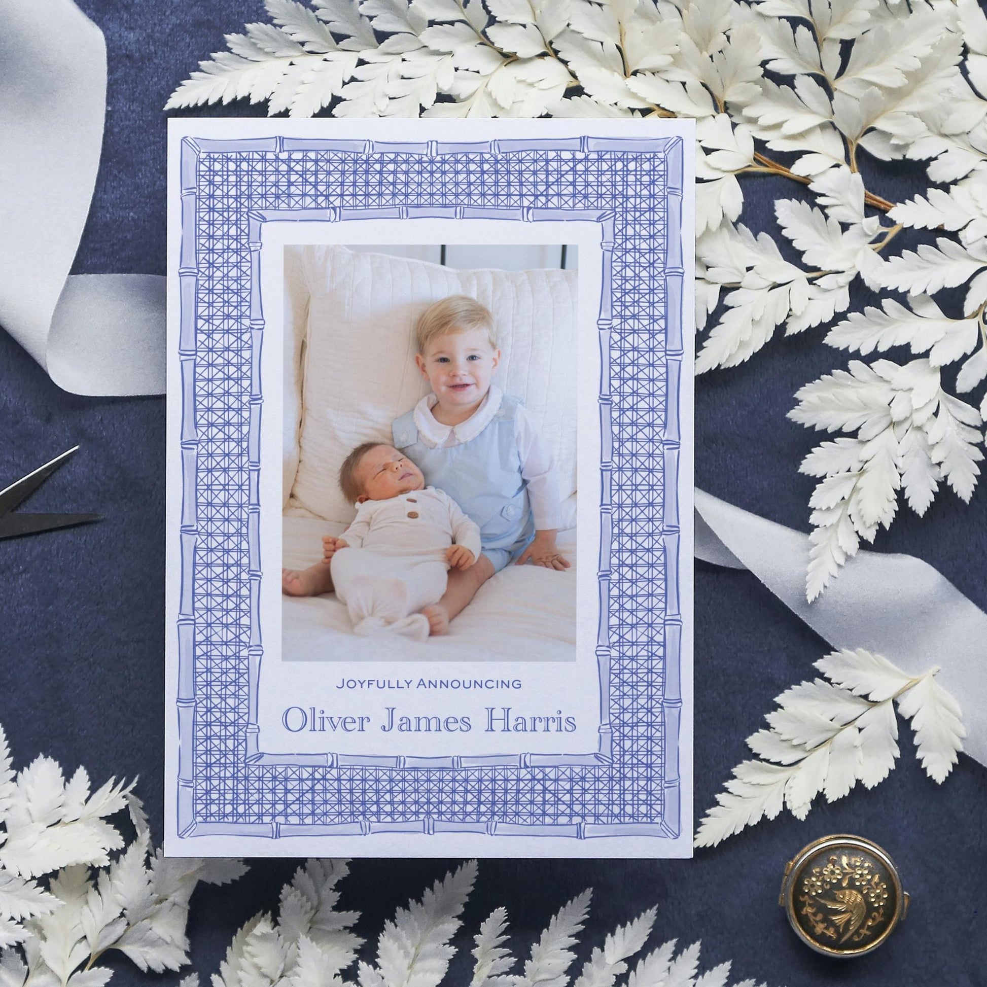 a card with a picture of a baby and a button