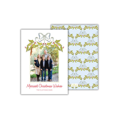 A Christmas card featuring a family photo with the text "Merryst Christmas Wishes" and "The Claytons, 2020" printed on it.
