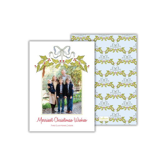 A Christmas card featuring a family photo with the text &quot;Merryst Christmas Wishes&quot; and &quot;The Claytons, 2020&quot; printed on it.