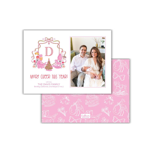 The image is a personalized family photo card featuring a couple sitting together on a couch, with a decorative border and a pink background.