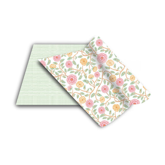 two folded napkins with floral designs on them