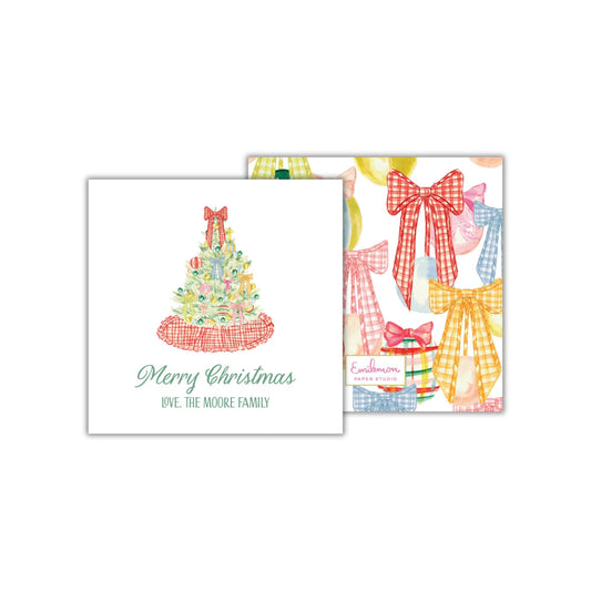 The image is a Christmas card featuring a Christmas tree with bows and presents.