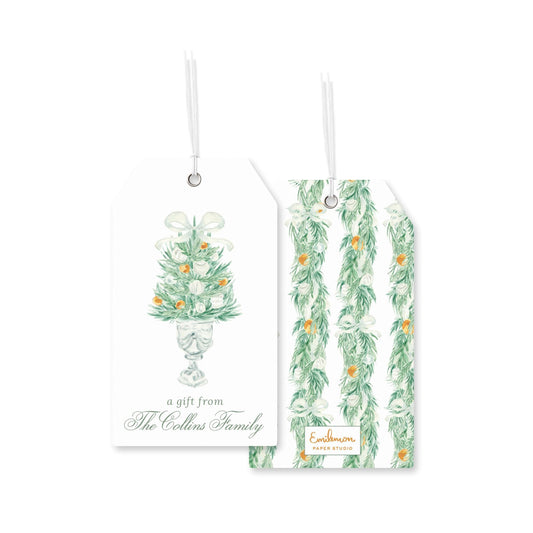 two white tags with illustrations of floral arrangements and text that reads &quot;a gift from The Collins Family&quot;.