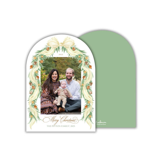 A family portrait of a couple and their child, with a decorative border and text that reads &quot;Merry Christmas&quot; and &quot;The Peton Family 2015&quot;.