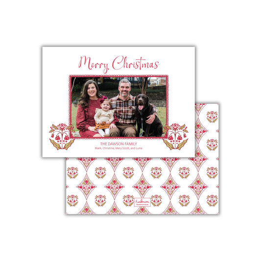 A Christmas card featuring a family photo of a man, woman, and child, along with a patterned background.