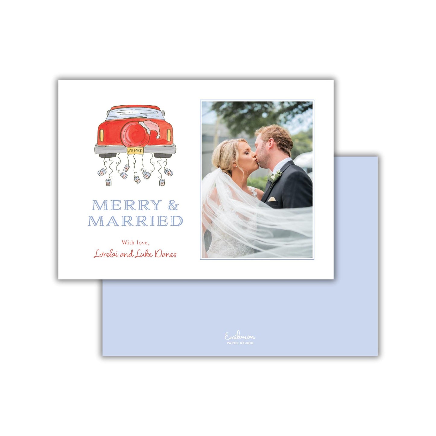 A wedding invitation card with a couple kissing and a red car with a bride and groom on it.