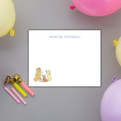 a white card with a personalized message, surrounded by colorful balloons and party decorations.