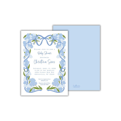 The image is a baby shower invitation featuring a blue floral design with a ribbon border.