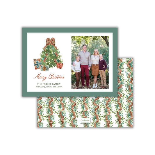 A Christmas card featuring a family photo and a Christmas tree design.