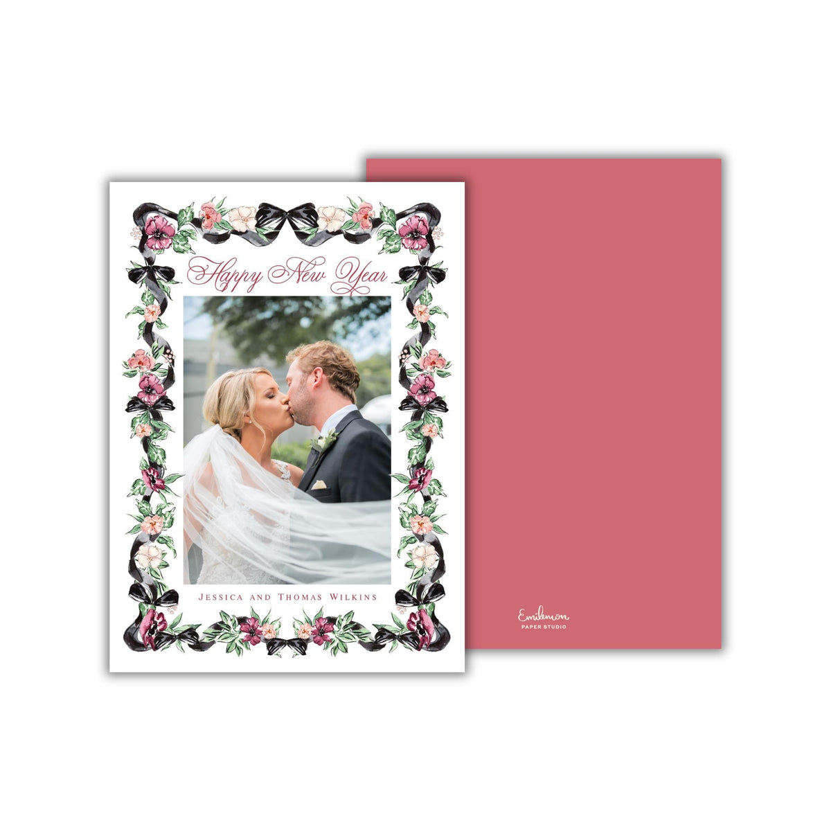 A wedding card featuring a bride and groom kissing, with a floral border and text that reads "Happy New Year".