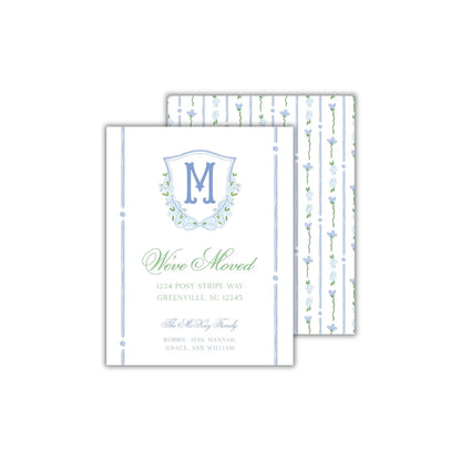 a white and blue wedding card with a monogrammed initial