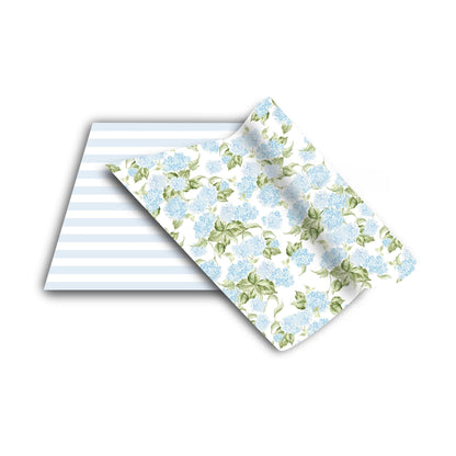 two pieces of paper with blue flowers on them