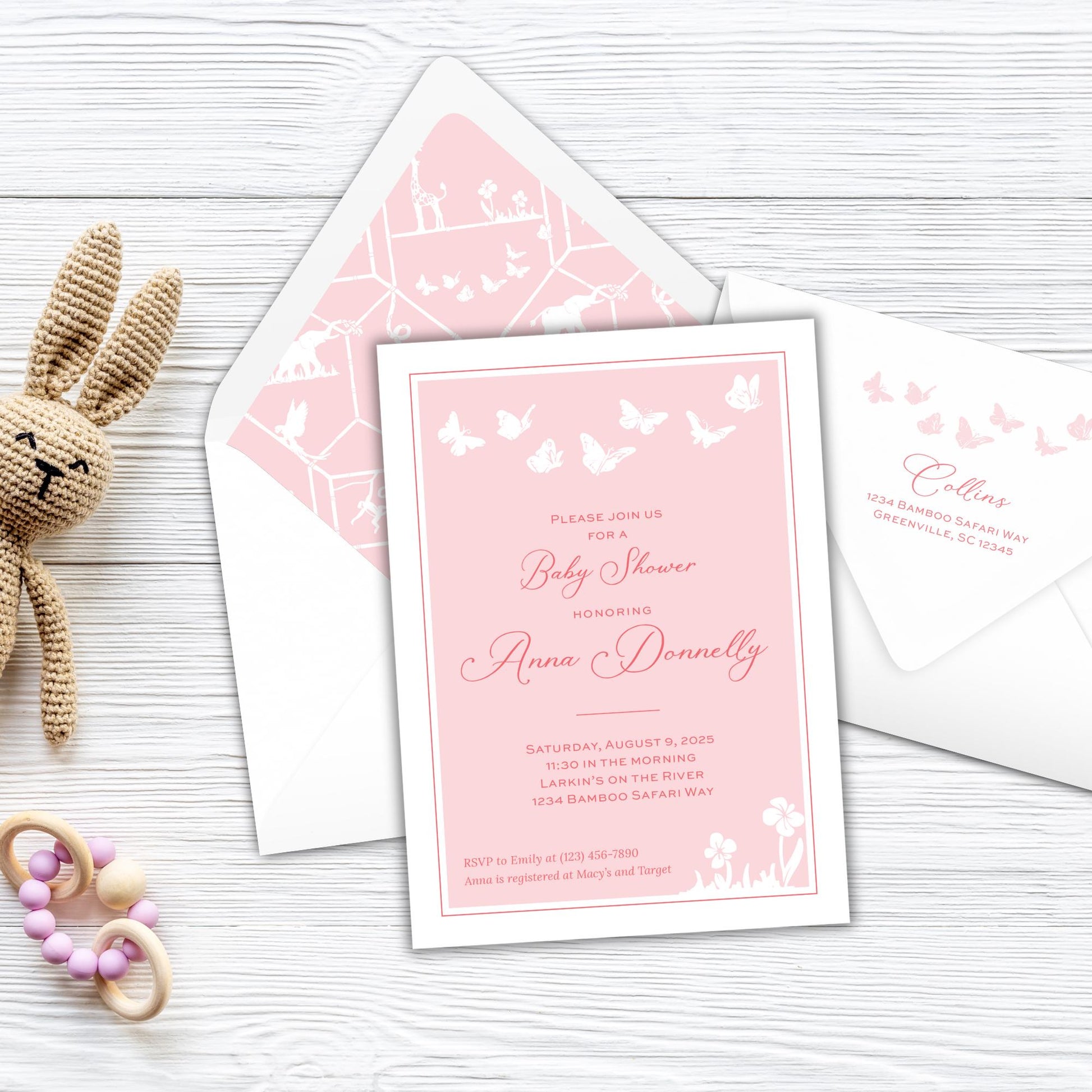 a stuffed animal next to a pink and white wedding card