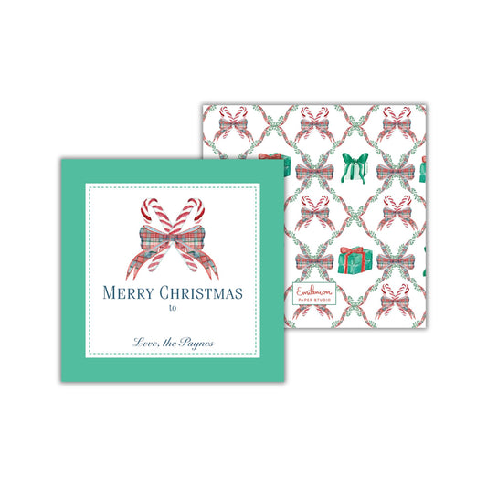 a green square with a white border and a pattern of red and white bows on a white background. The text on the square reads &quot;Merry Christmas to Love, the Paynes&quot;.