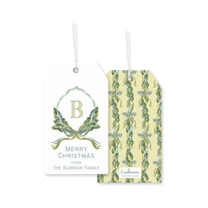 two tags, one with a floral design and the other with a repeating pattern of green leaves and blue flowers.